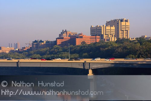 Moos Tower, Fairview University Medical Center, and the Masonic Cancer Research Center early in the morning, behind the Dartmouth I-94 bridge.